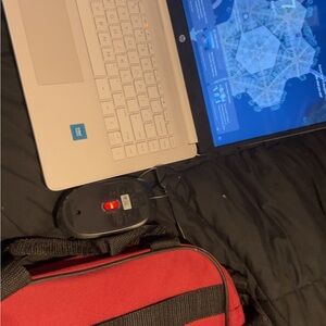 HP White Laptop with Black and Red Accessories